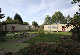 Both pairs of classrooms and, behind them, the staff room 